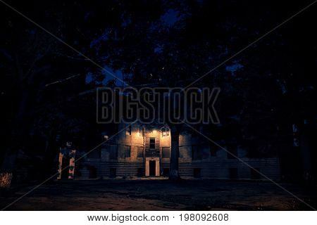 An abandoned city public housing project building with boarded up windows at Lathrop Homes in Chicago at night.