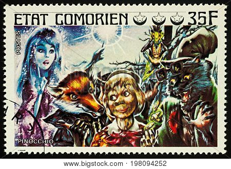 Moscow Russia - August 02 2017: A stamp printed in Comoros shows scene from a fairy tale Pinocchio series 