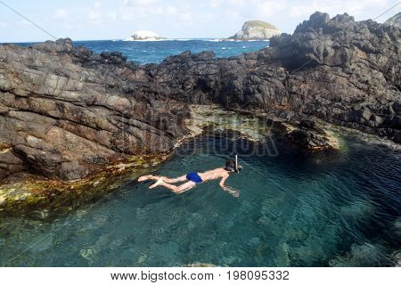 Swimming in a natural pool in Fernando de Noronha