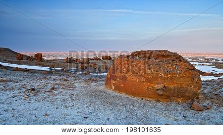 Unusual round red boulders in Red Rock Coulee in Southern Alberta, Canada.