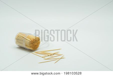 Toothpicks in a clear plastic bottle. And some fell on the floorToothpick slant Toothpick splatter