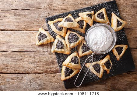 Hamentashen Triangular Cookies With Poppy Seed For Purim Holiday Close-up. Horizontal Top View
