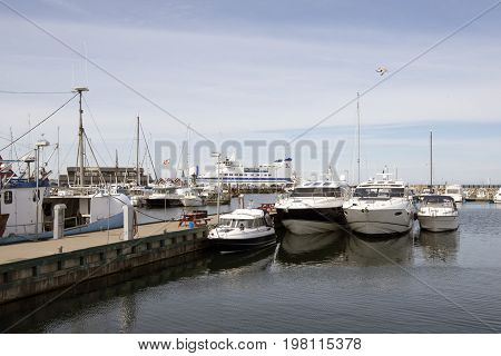 Vesteroe Denmark July 25 2017: Vesteroe harbour with boats and Laesoe ferry in the background. Laesoe Denmark 2017.