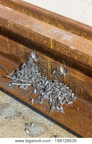 Holes In The Rail For The Bolts With Metal Swarfs