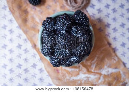 Homemade, sweet, delicious blackberries in a handmade dish
