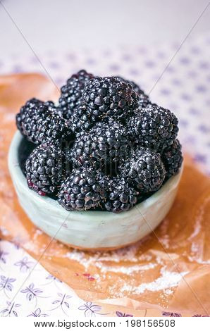Homemade, sweet, delicious blackberries in a handmade dish