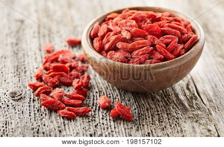 Goji berries on a wooden board