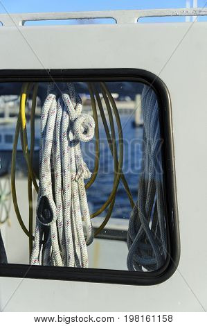 Hanging coils of line on small fishing boat