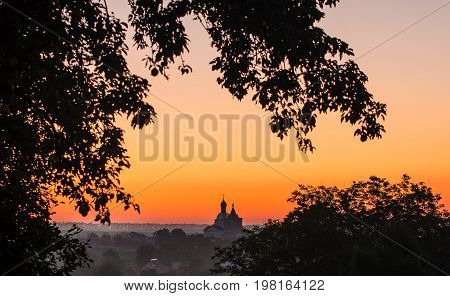 Christian church in the east sun. Church on the horizon.