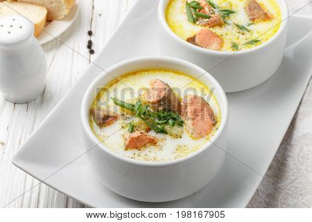 Creamy Fish Soup With Salmon, Potatoes, Onions And Carrots. Kalakeitto. Traditional Dish Of The Finn
