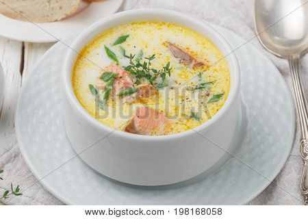 Creamy fish soup with salmon potatoes onions and carrots. Kalakeitto. Traditional dish of the Finnish cuisine