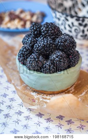 Homemade, sweet, delicious blackberries in a handmade dish