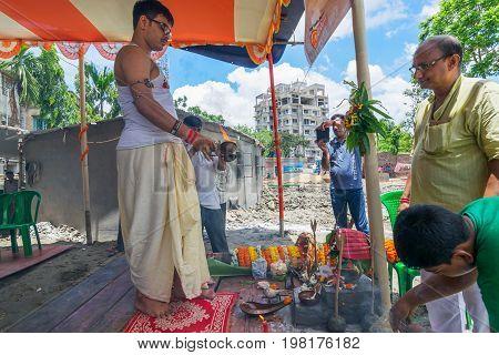 HOWRAH WEST BANGALINDIA - JULY 7TH 2017 : khutipuja the starting ritual of world famous Durga Puja (most famous festival of Hinduism) is being performed by a Hindu Priest amongst Hindu devotees.