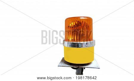 Orange rotating beacon on white reflective background.