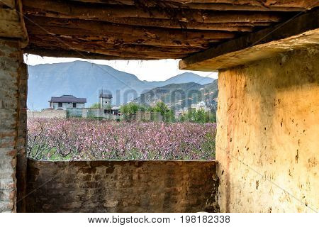 View of Swat valley in Pakistan through a window of old mud house.