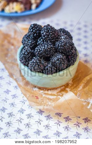 Homemade, sweet, delicious blackberries in a handmade dish