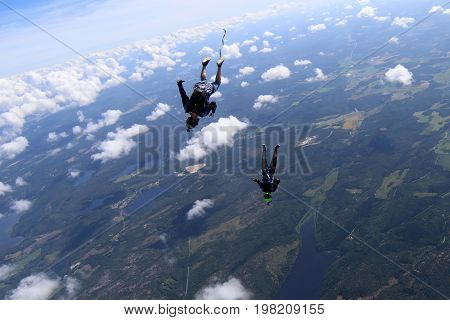 Skydiving over beautiful Norway. Clouds, sun and sky