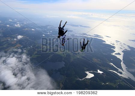 Skydiving over beautiful Norway. Clouds, sun and sky