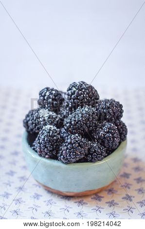 Homemade, sweet, delicious blackberries in a handmade dish