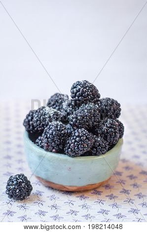 Homemade, sweet, delicious blackberries in a handmade dish