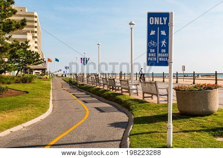 VIRGINIA BEACH, VIRGINIA - JULY 13, 2017:  Sign marking the bike path which parallels the oceanfront boardwalk.