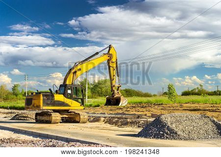 Crawler Excavator digging bucket on construction of high-speed bypass road around Krasnoe Selo Saint Petersburg. Heavy machine equipment for excavation works at civil industrial construction. Russia