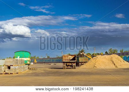 Heavy empty truck is waiting for loading of gravel. Construction of high-speed bypass road around Krasnoe Selo Saint Petersburg. Heavy machine equipment for civil industrial construction. Russia