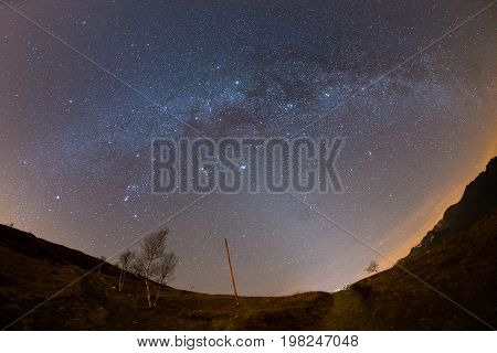 The Starry Sky And Milky Way Captured On The Alps By Fisheye Lens With Scenic Distortion And 180 Deg
