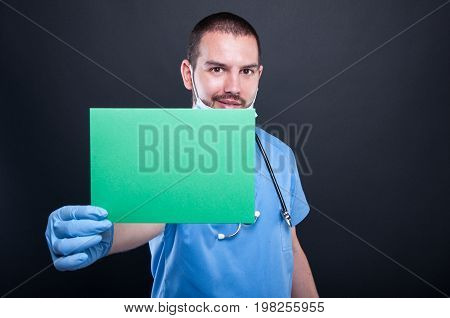 Medic Holding And Showing Green Copypsace Card