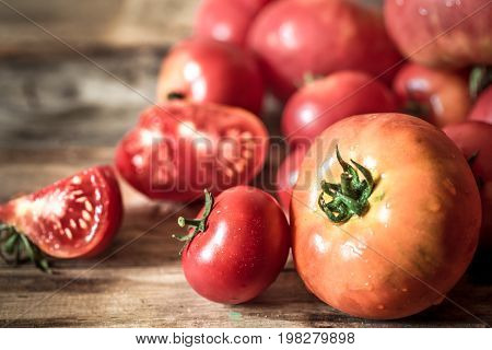 Ripe Tomatoes On Wooden Background Close-up