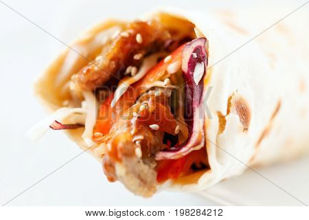 tortilla fajita wraps with meat and vegetables