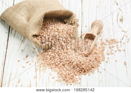 Raw Organic Devzira Rice On A White Table