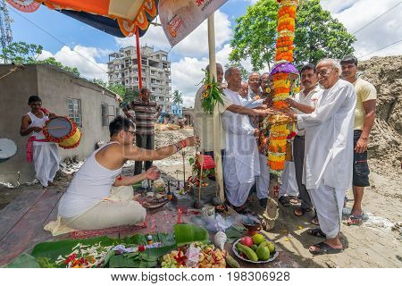 HOWRAH WEST BANGALINDIA - JULY 7TH 2017 : khutipuja the starting ritual of world famous Durga Puja (most famous festival of Hinduism) is being performed by a Hindu Priest amongst Hindu devotees.