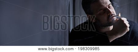 Depressed Man Smoking Cigarette