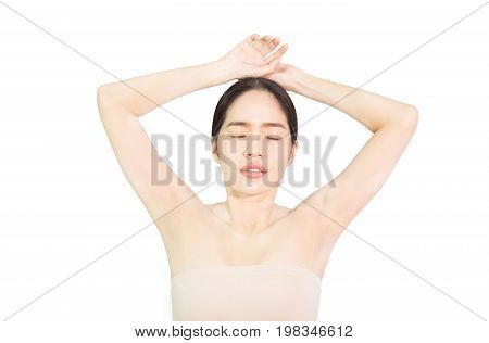 Beautiful young Asian woman show armpit that slick white , skin care and clean skin and spa concept , isolated on white background