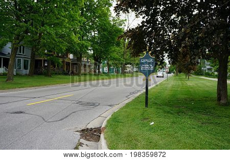 CADILLAC, MICHIGAN / UNITED STATES -  MAY 31, 2017: A sign welcomes visitors to Cadillac's Courthouse Hill Historic District, where residents live in preserved historic homes.