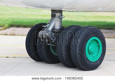 The chassis of transport aircraft are multi-wheeled on relatively short racks.