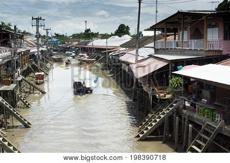 SAMUT SONGKHRAM, THAILAND - JULY 22, 2017 : AMPHAWA FLOATING MARKET is one of the most exciting and colorful places to visit in Thailand today.