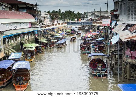 SAMUT SONGKHRAM, THAILAND - JULY 22, 2017 : AMPHAWA FLOATING MARKET is one of the most exciting and colorful places to visit in Thailand today.