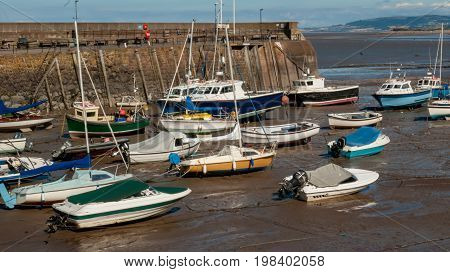 Boats at low tide in Minehead harboard Minehead Somerset UK.