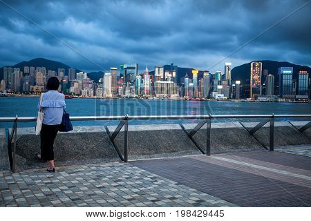 HONG KONG â JULY 18, 2017: Victoria Harbor view with Hong Kong skyline and urban skyscrapers