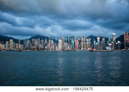 HONG KONG â JULY 18, 2017: Victoria Harbor view with Hong Kong skyline and urban skyscrapers