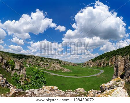 mountain landscape with some of the oldest limestone rock formations in Europe in Dobrogea Gorges (Cheile Dobrogei) Romania