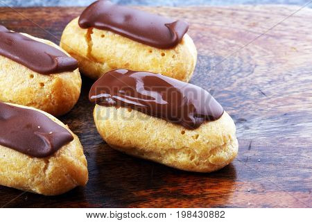 Traditional French Dessert. Eclair With Chocolate Icing. Pastery Concept