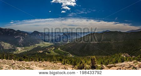 Trail Ridge Road is the name for a stretch of U.S. Highway 34 that traverses Rocky Mountain National Park from Estes Park Colorado in the east to Grand Lake Colorado in the west offering stunning mountain views.