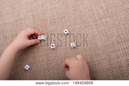 Colorful Alphabet Letter Cubes In Hand