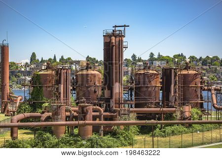 Abandoned Machines And Storage Units In A Gas Industry At Gas Works Park Seattle Homes Behind