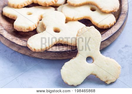 Homemade shortbread cookies made in trendy spinner toy form horizontal copy space