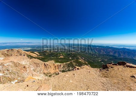Pikes Peak is the highest summit of the southern Front Range of the Rocky Mountains. The ultra-prominent fourteener is located in Pike National Forest 12 miles west of downtown Colorado Springs. The mountain is named in honor of American explorer Zebulon