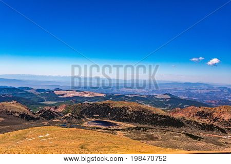 Pikes Peak is the highest summit of the southern Front Range of the Rocky Mountains. The ultra-prominent fourteener is located in Pike National Forest 12 miles west of downtown Colorado Springs. The mountain is named in honor of American explorer Zebulon